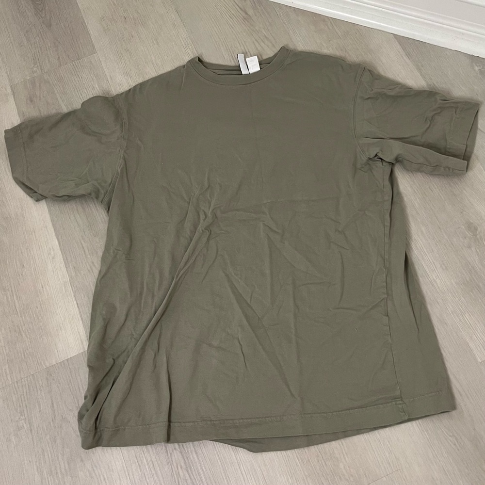 green T-shirt